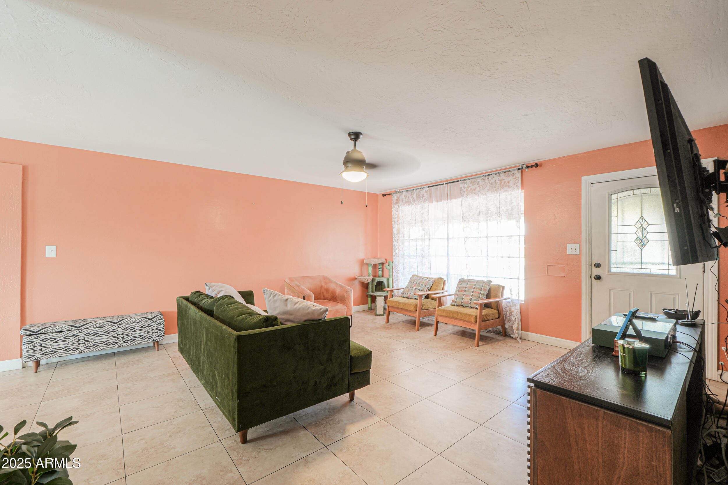 3413 West Ocotillo Road Phoenix, AZ 85017 - Photo 5 of 29 a living room with furniture and a window