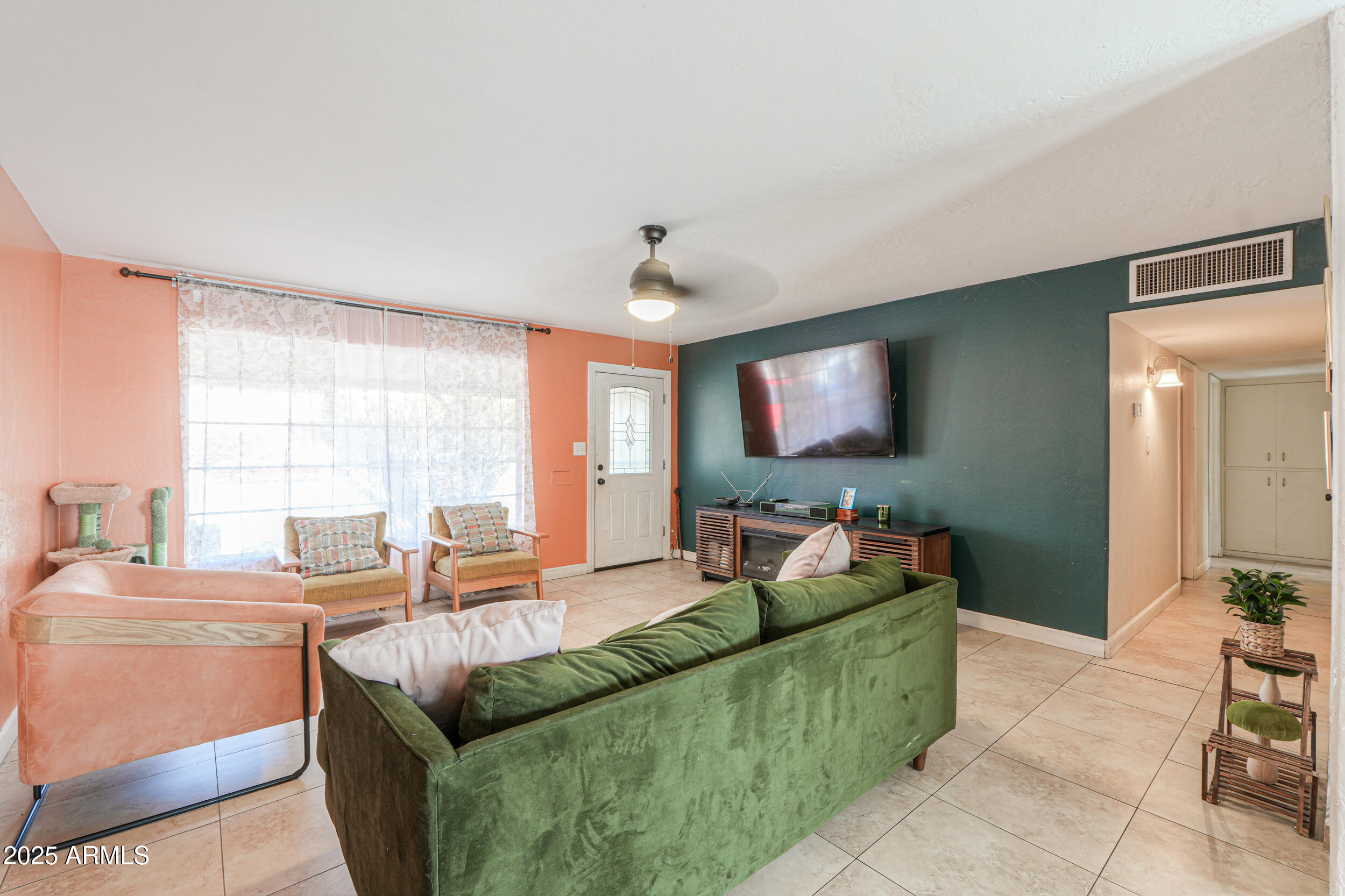3413 West Ocotillo Road Phoenix, AZ 85017 - Photo 6 of 29 a living room with furniture and a flat screen tv