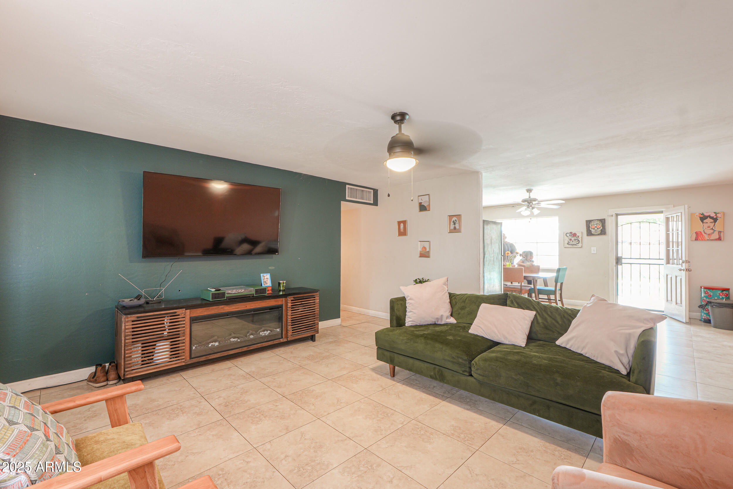 3413 West Ocotillo Road Phoenix, AZ 85017 - Photo 7 of 29 a living room with furniture and a flat screen tv