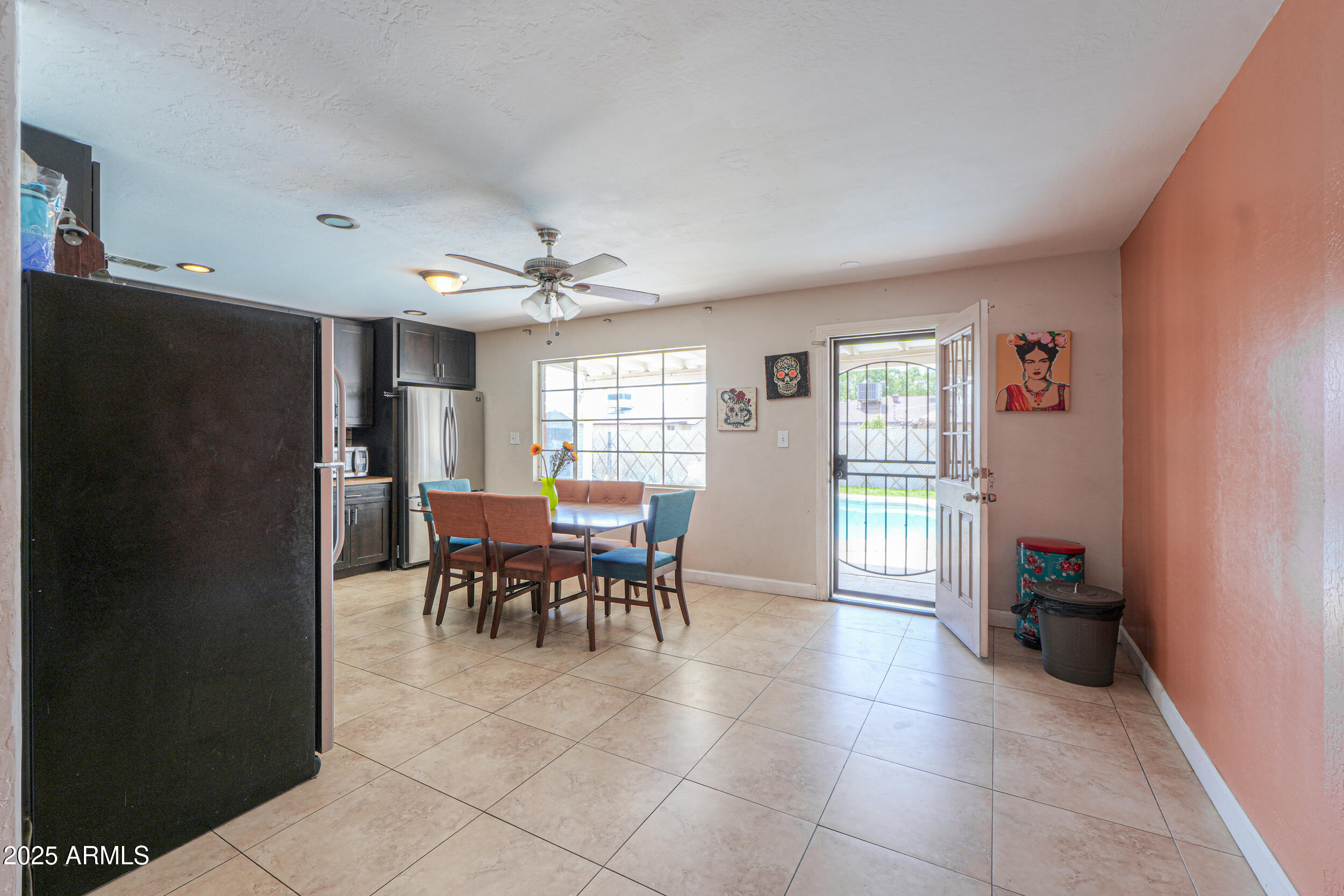 3413 West Ocotillo Road Phoenix, AZ 85017 - Photo 8 of 29 a view of a dining room with furniture and a chandelier