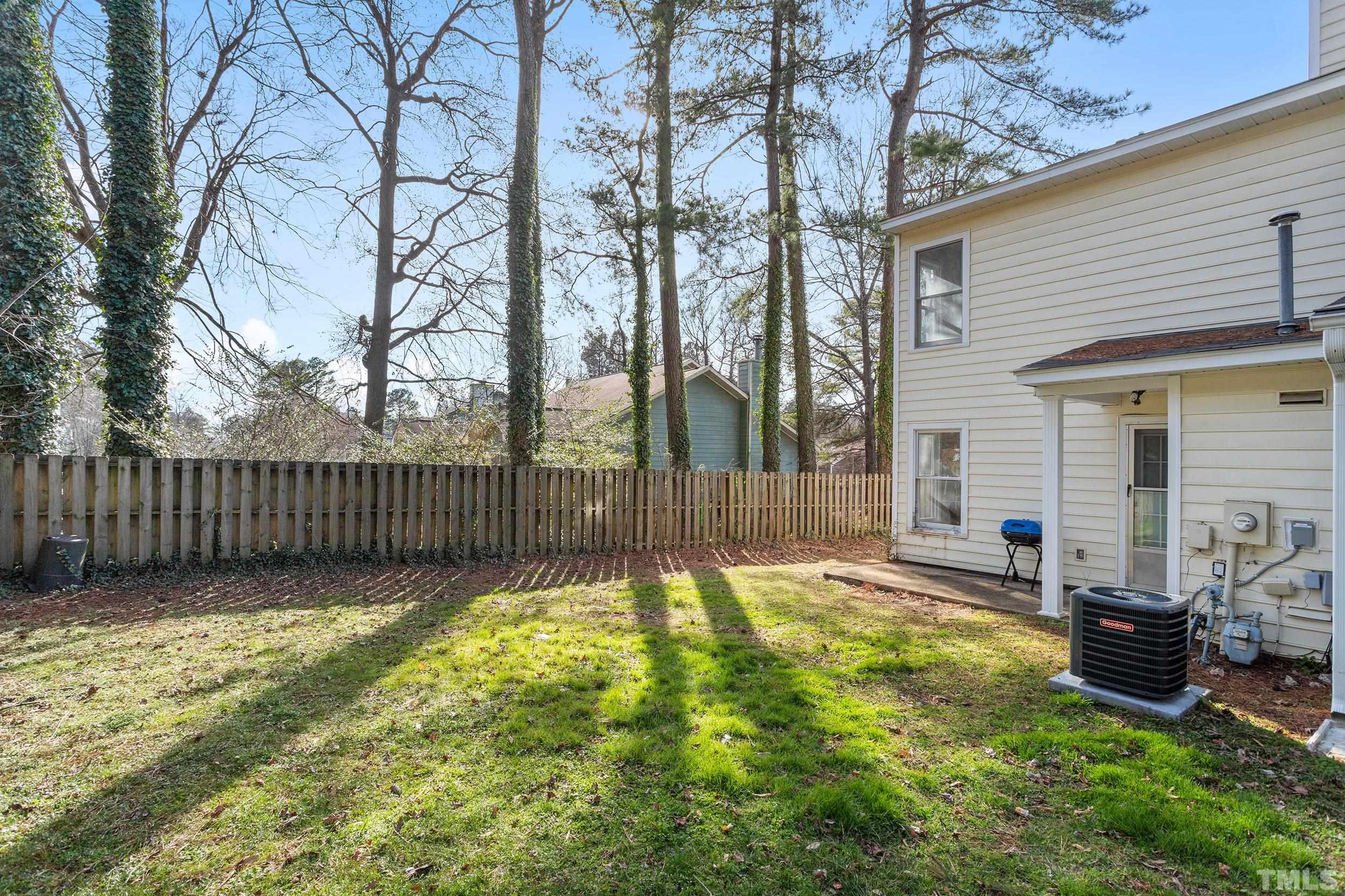 4416 Roller Court Raleigh, NC 27604 - Photo 4 of 33 a view of a backyard with a large tree