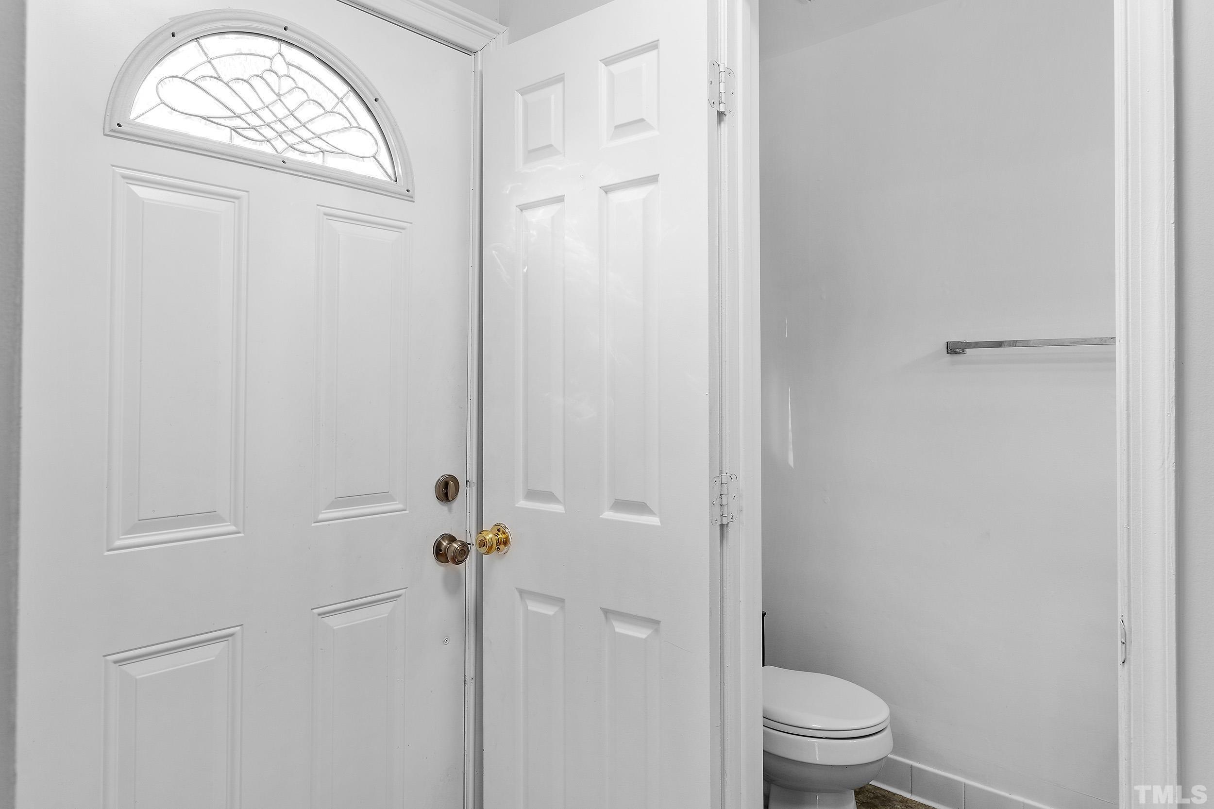 4416 Roller Court Raleigh, NC 27604 - Photo 9 of 33 a bathroom with a toilet and a shower
