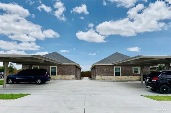 a view of a car parked in front of a house