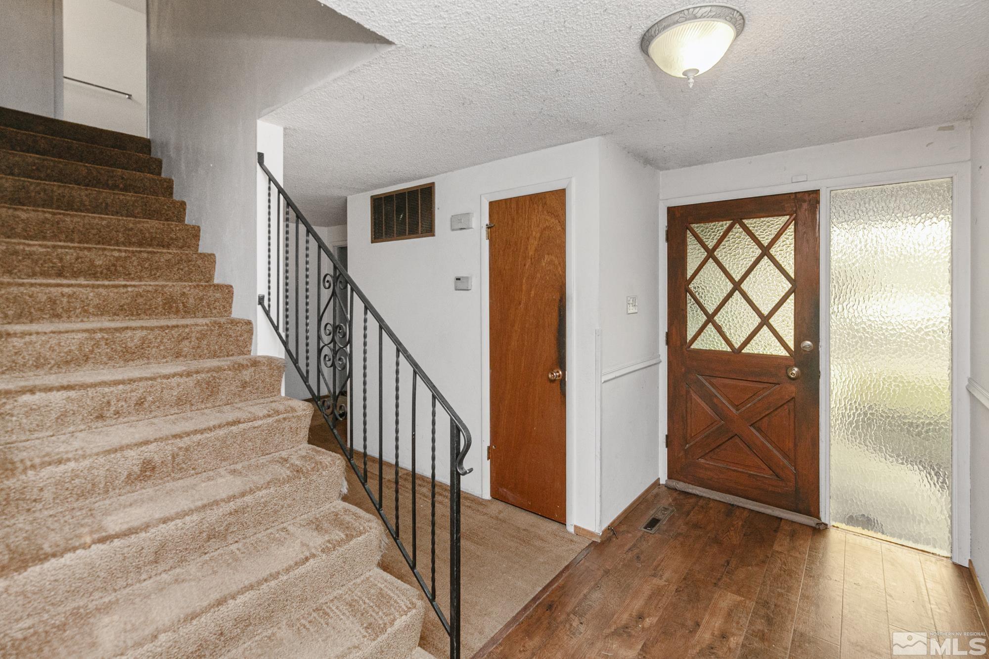 2300 Balsam Street Reno, NV 89509 - Photo 11 of 40 a view of a hallway with wooden floor and entryway