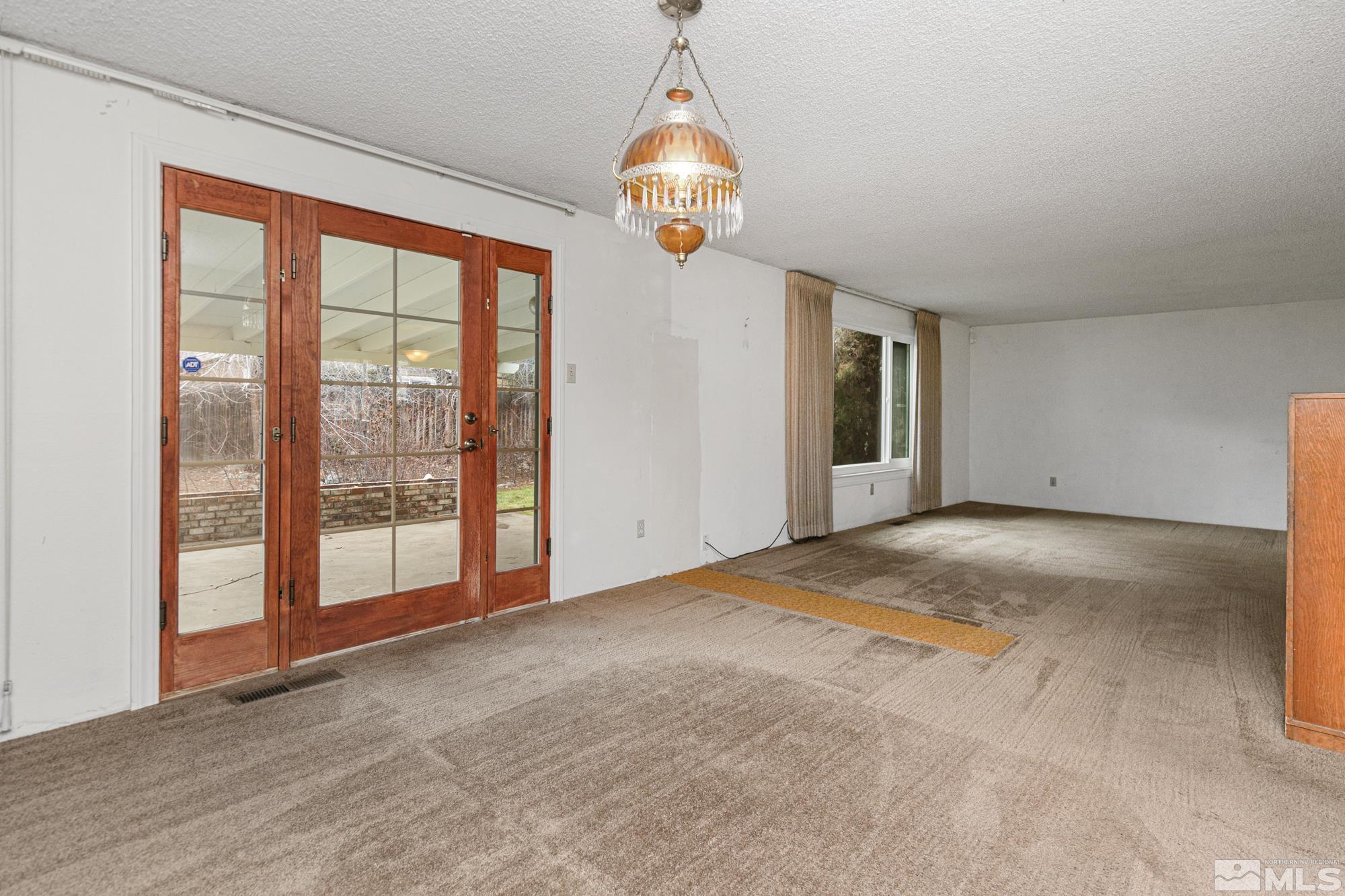 2300 Balsam Street Reno, NV 89509 - Photo 14 of 40 a view of an empty room with glass door and balcony