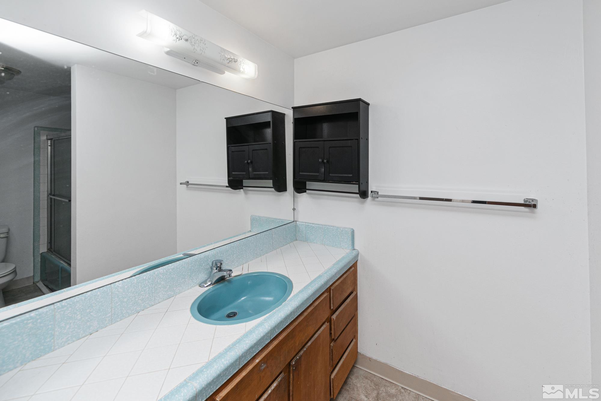 2300 Balsam Street Reno, NV 89509 - Photo 21 of 40 a bathroom with a sink and a mirror