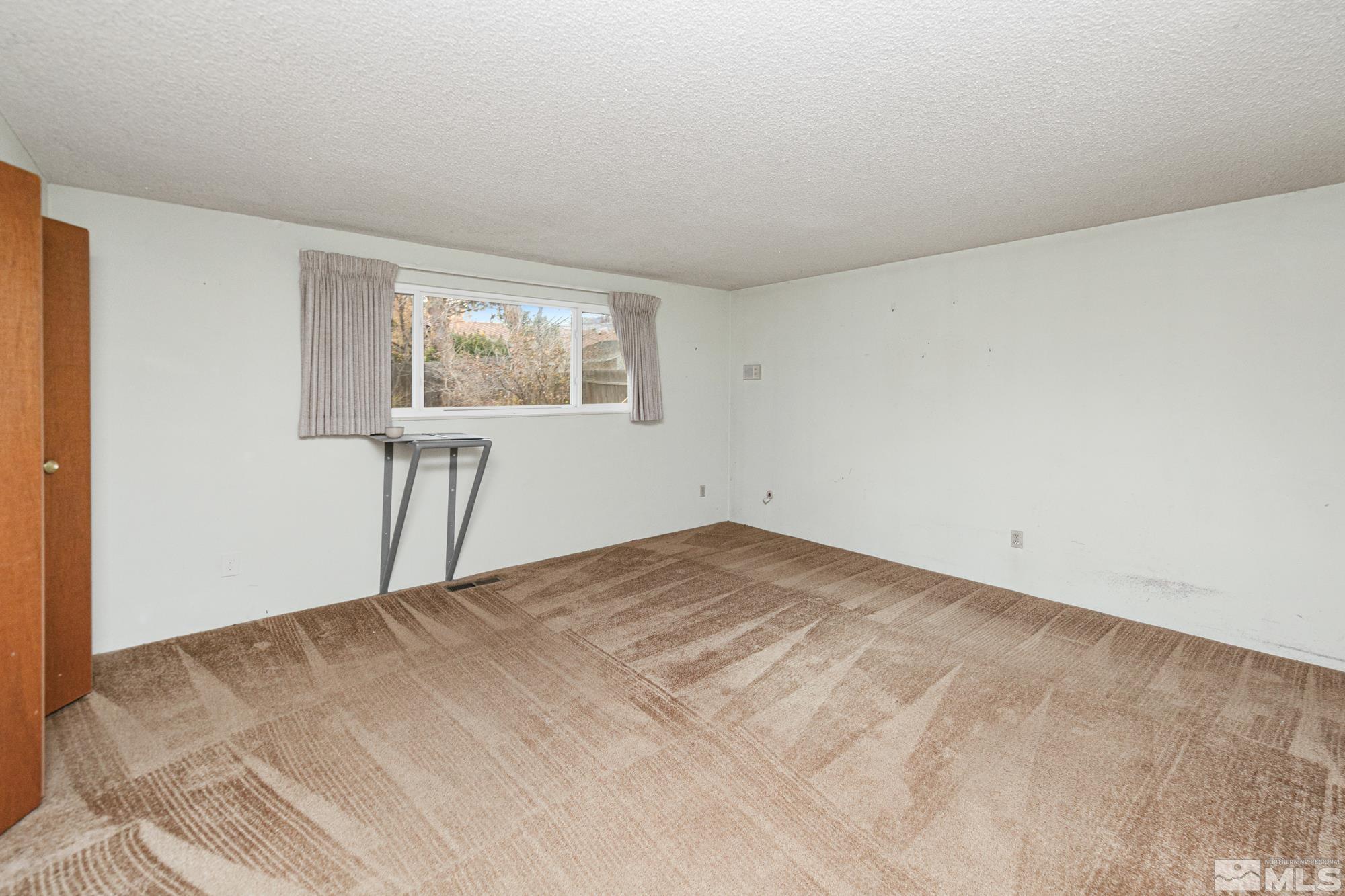 2300 Balsam Street Reno, NV 89509 - Photo 27 of 40 a view of empty room with wooden floor