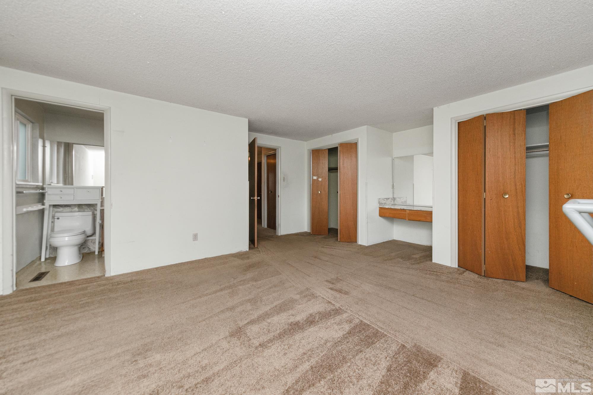 2300 Balsam Street Reno, NV 89509 - Photo 28 of 40 a view of a livingroom with wooden floor and cabinet