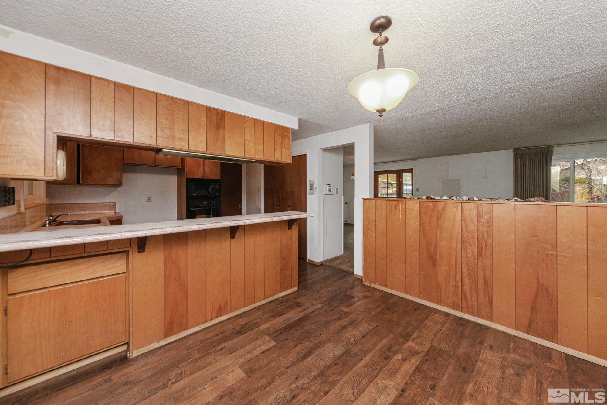 2300 Balsam Street Reno, NV 89509 - Photo 9 of 40 a kitchen with stainless steel appliances a refrigerator and a sink