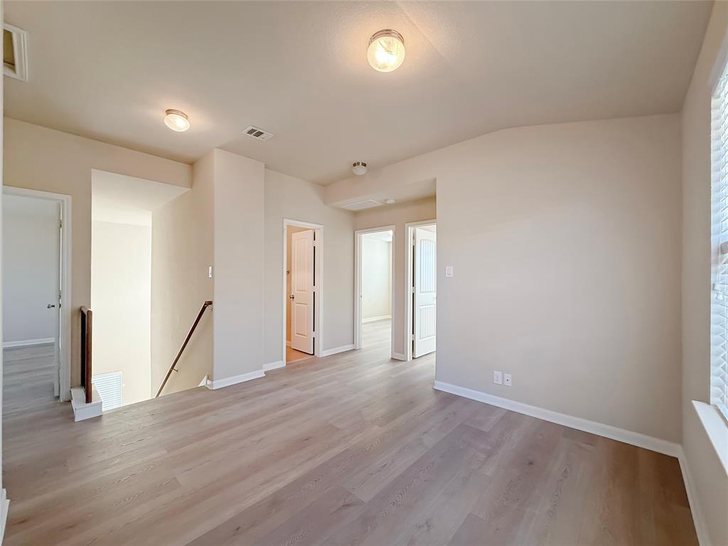 8505 Inca Dove Drive Austin, TX 78729 - Photo 16 of 30 This space features light-toned flooring, white walls, and recessed lighting fixtures