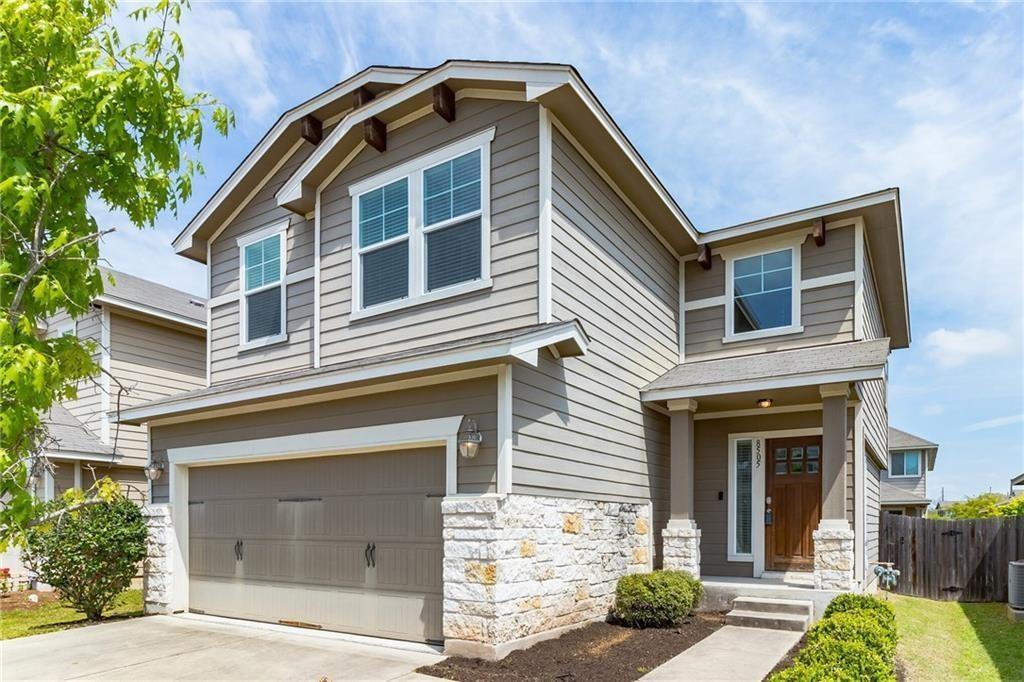 8505 Inca Dove Drive Austin, TX 78729 - Photo 2 of 30 The property features a two-story exterior with horizontal siding and stone accents