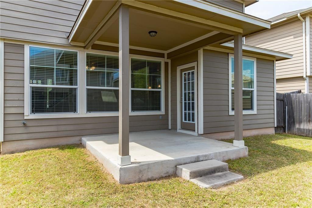 8505 Inca Dove Drive Austin, TX 78729 - Photo 28 of 30 The property features a covered concrete patio with steps leading to a grassy yard