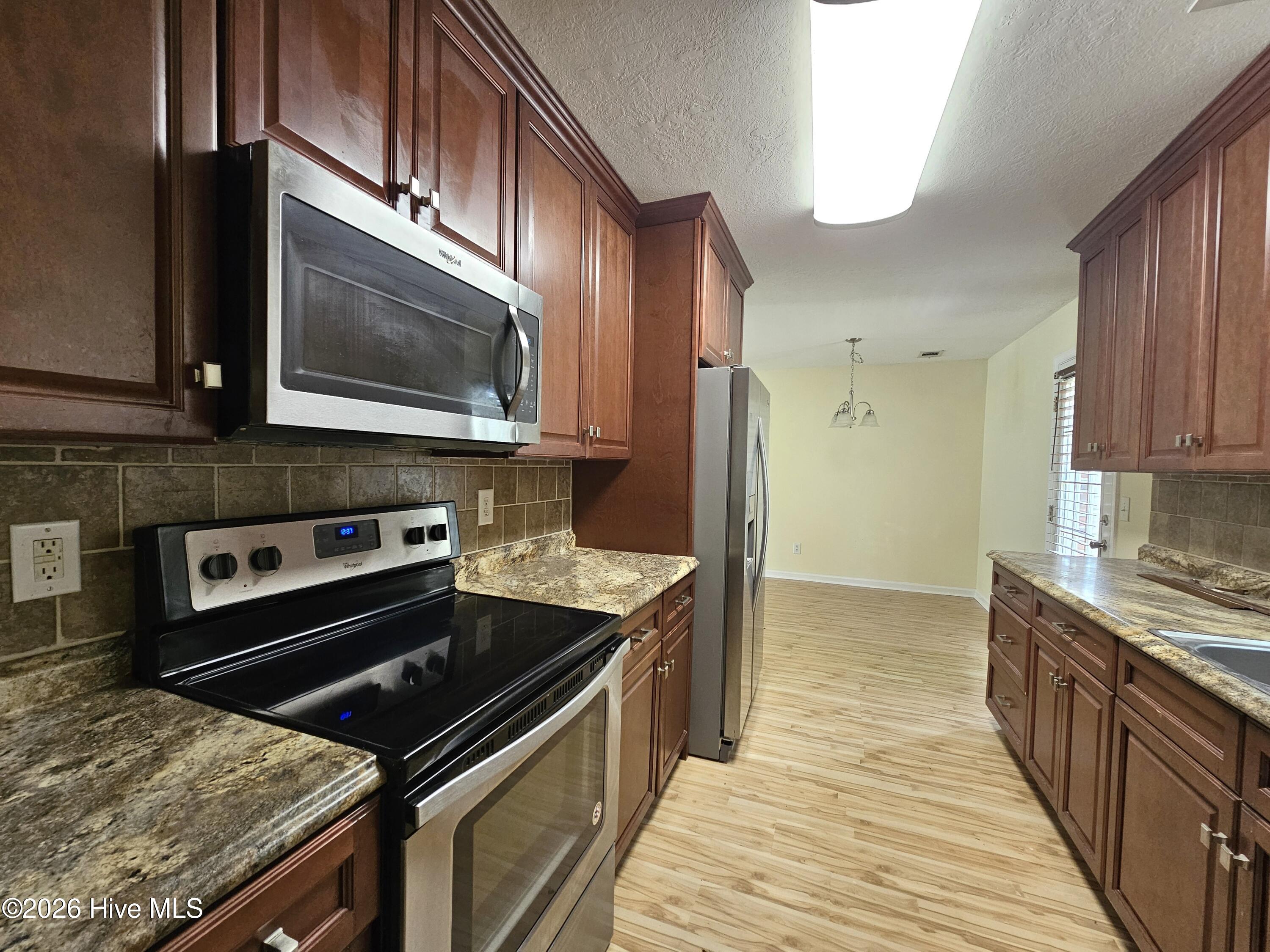 206 Corley Circle Grovetown, GA 30813 - Photo 4 of 12 Kitchen - stainless steel appliances, kitchen window & pantry
