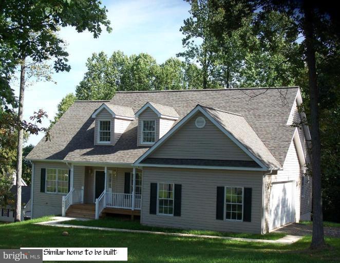 277 Freezeland Loop Road Linden, VA 22642 - Photo 1 of 10 a front view of a house with a garden and trees