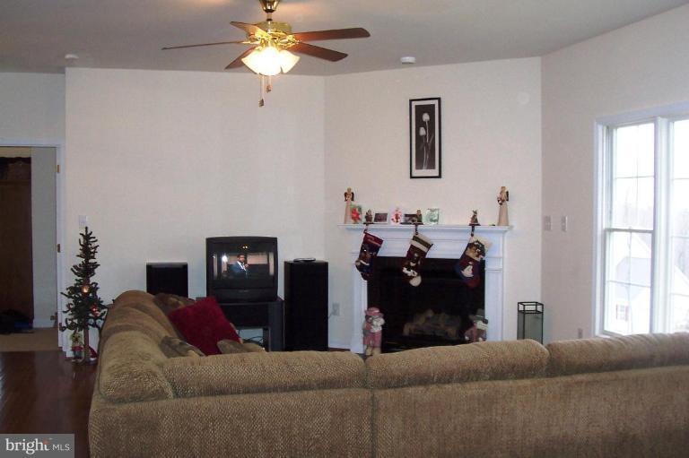 277 Freezeland Loop Road Linden, VA 22642 - Photo 2 of 10 a living room with furniture and a window