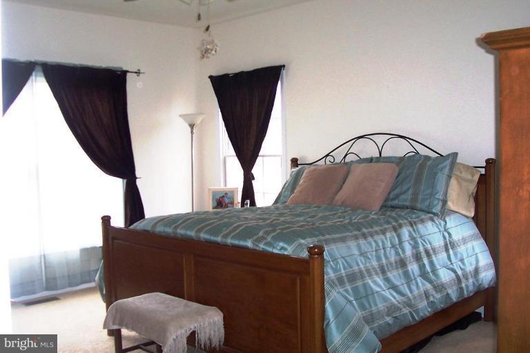 277 Freezeland Loop Road Linden, VA 22642 - Photo 6 of 10 a bedroom with furniture and a window