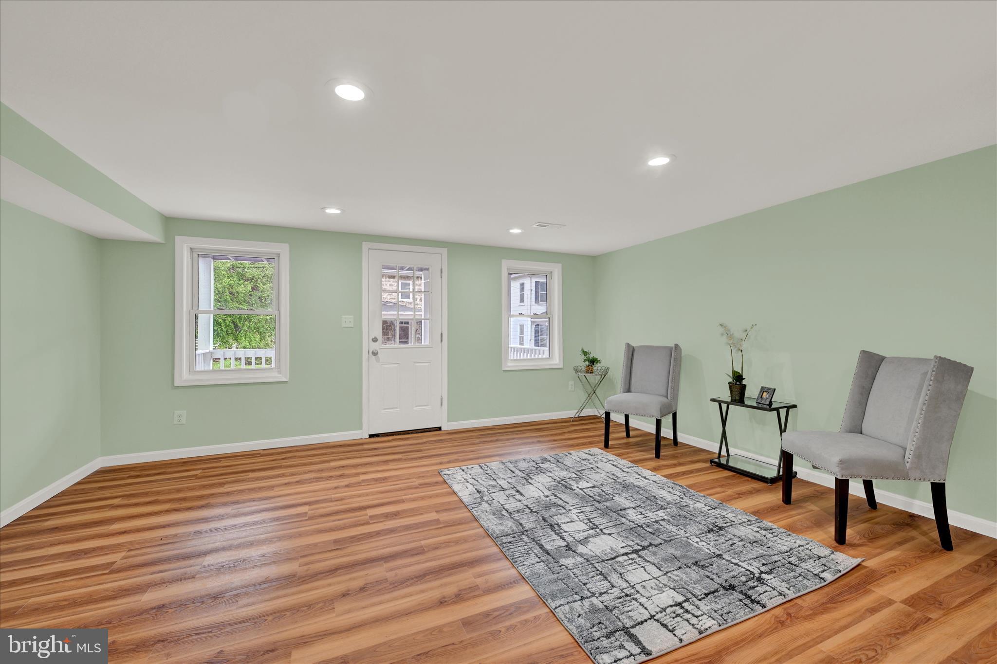 8511 Frederick Road Ellicott City, MD 21043 - Photo 11 of 36 a bedroom with a bed and wooden floor
