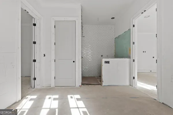 a view of a bathroom with a sink and a mirror