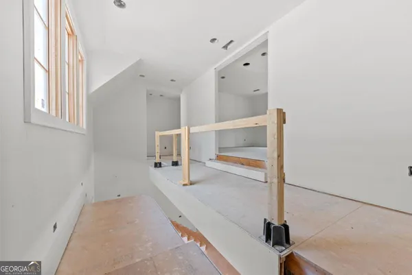 a view of a hallway with staircase