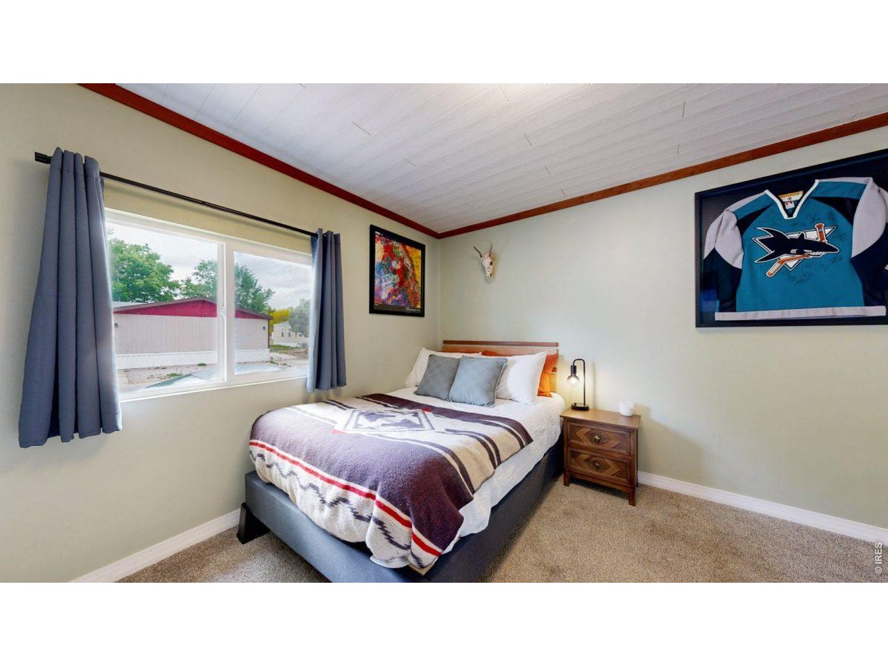 2500 East Harmony Road, Unit 18 Fort Collins, CO 80528 - Photo 12 of 41 a living room with a bed furniture and a large window