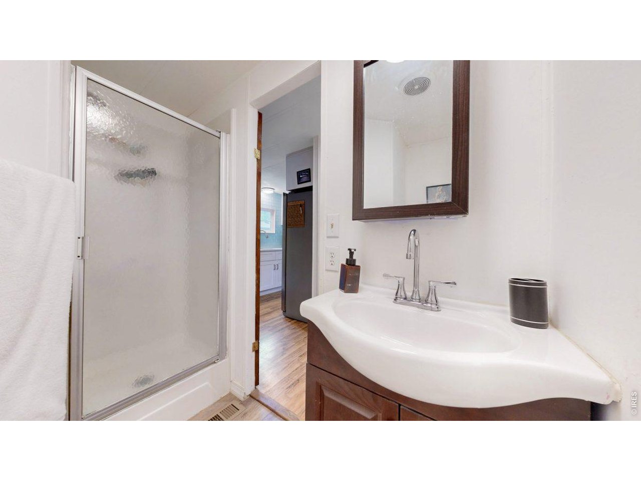 2500 East Harmony Road, Unit 18 Fort Collins, CO 80528 - Photo 14 of 41 a bathroom with a sink a mirror and a shower