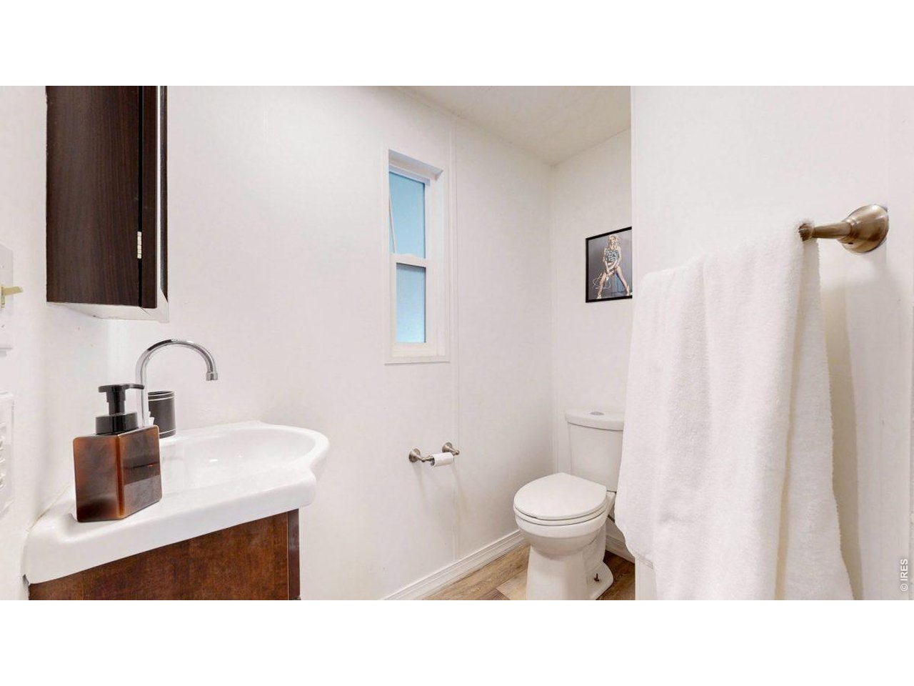 2500 East Harmony Road, Unit 18 Fort Collins, CO 80528 - Photo 15 of 41 a bathroom with a sink a toilet and a mirror