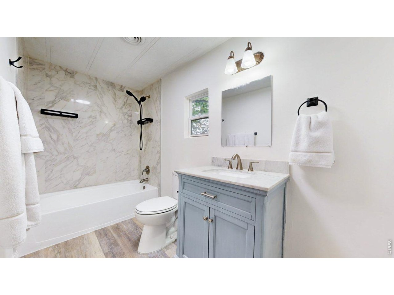 2500 East Harmony Road, Unit 18 Fort Collins, CO 80528 - Photo 19 of 41 a bathroom with a sink a toilet and shower