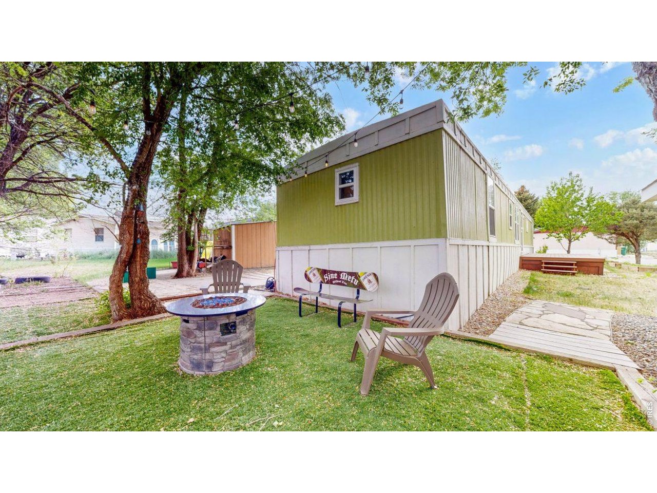2500 East Harmony Road, Unit 18 Fort Collins, CO 80528 - Photo 2 of 41 a backyard of a house with table and chairs