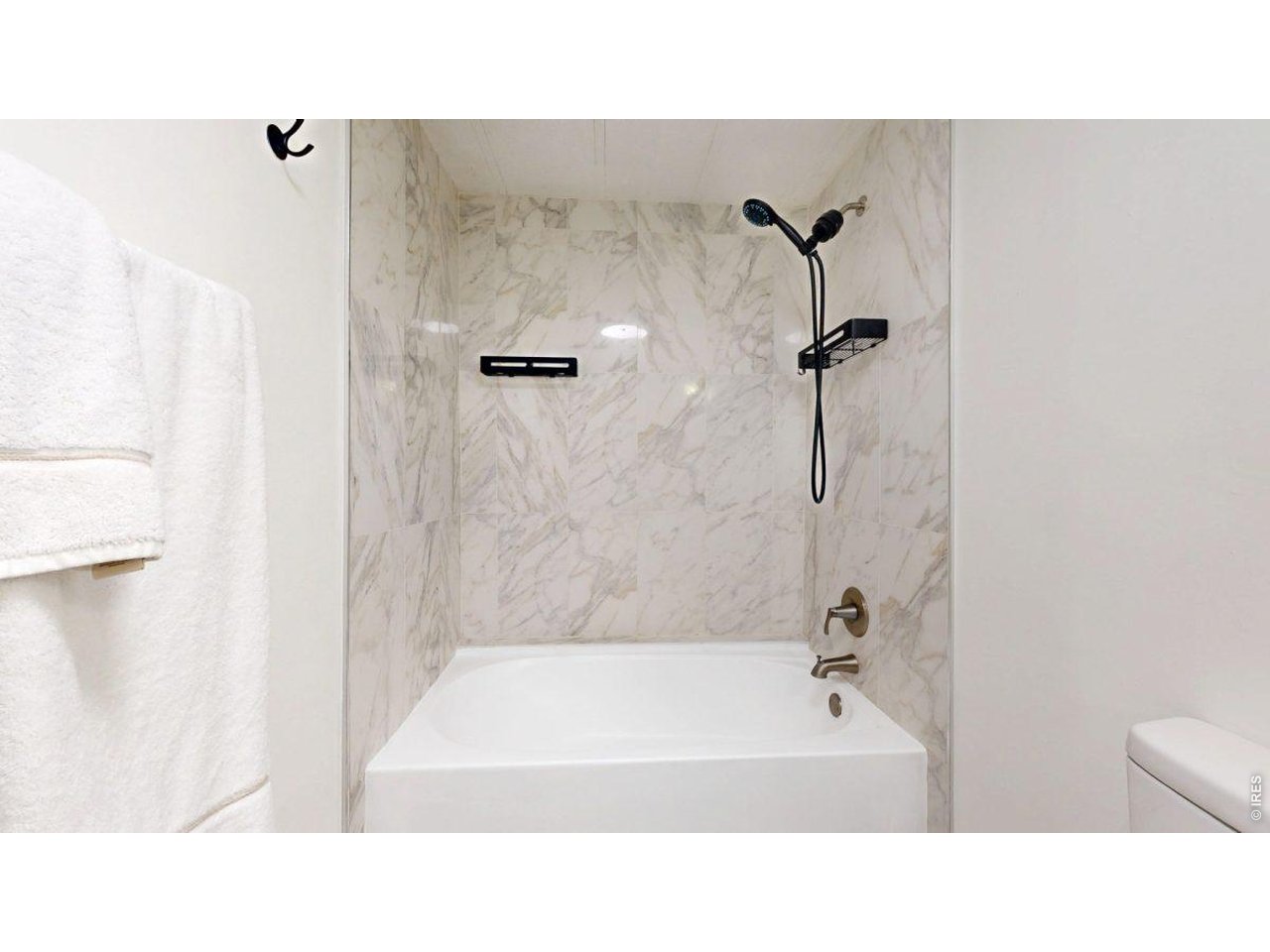 2500 East Harmony Road, Unit 18 Fort Collins, CO 80528 - Photo 21 of 41 a bathroom with a tub sink and mirror