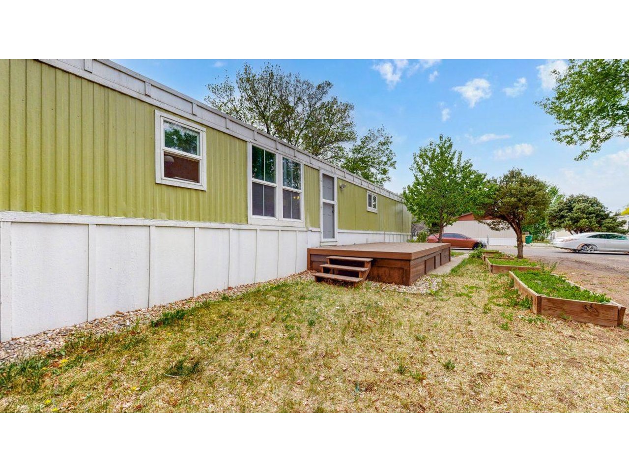 2500 East Harmony Road, Unit 18 Fort Collins, CO 80528 - Photo 27 of 41 a backyard of a house with lots of green space