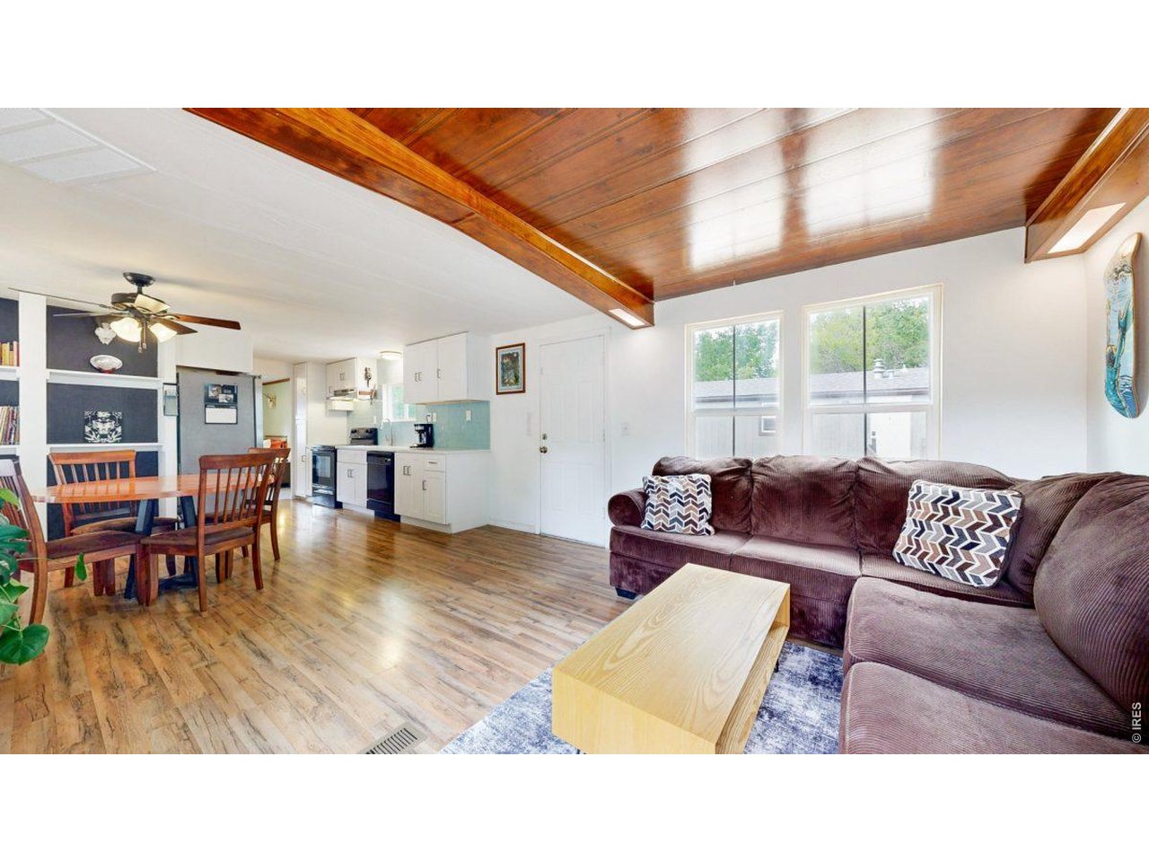 2500 East Harmony Road, Unit 18 Fort Collins, CO 80528 - Photo 5 of 41 a living room with furniture and wooden floor