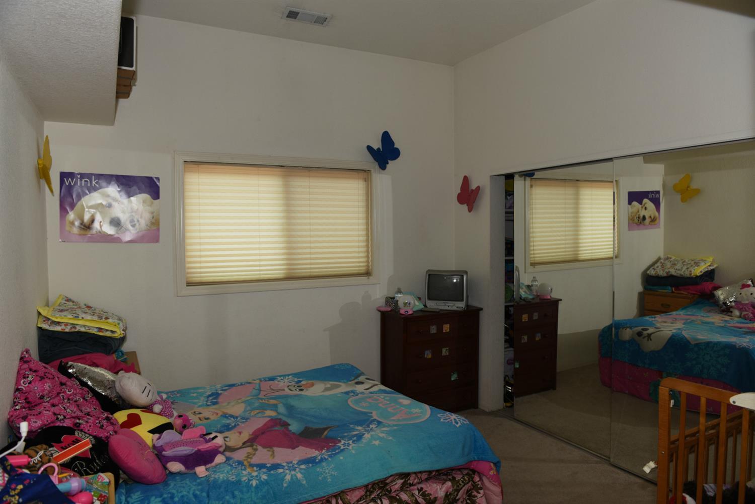736 Riverside Avenue Gold Hill, OR 97525 - Photo 8 of 8 a bedroom with a bed and wooden floor