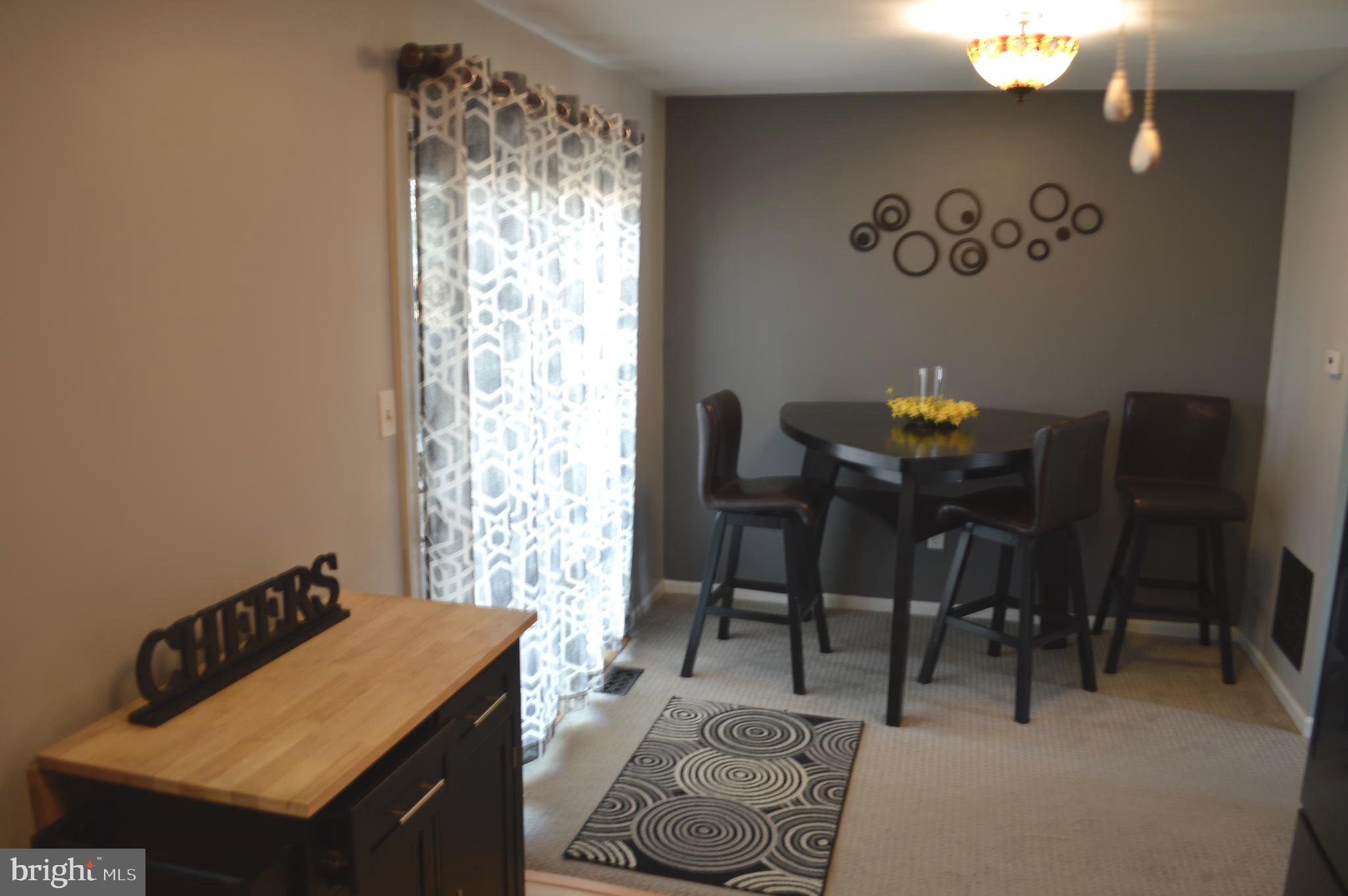 370 Scola Road Brookhaven, PA 19015 - Photo 9 of 23 Eating area showing sliders to rear yard