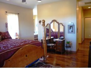 5000 Dillon Wash Road Prescott, AZ 86305 - Photo 4 of 12 a bedroom with a bed and a chandelier