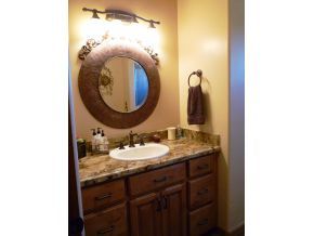 5000 Dillon Wash Road Prescott, AZ 86305 - Photo 7 of 12 a bathroom with a granite countertop sink and a mirror