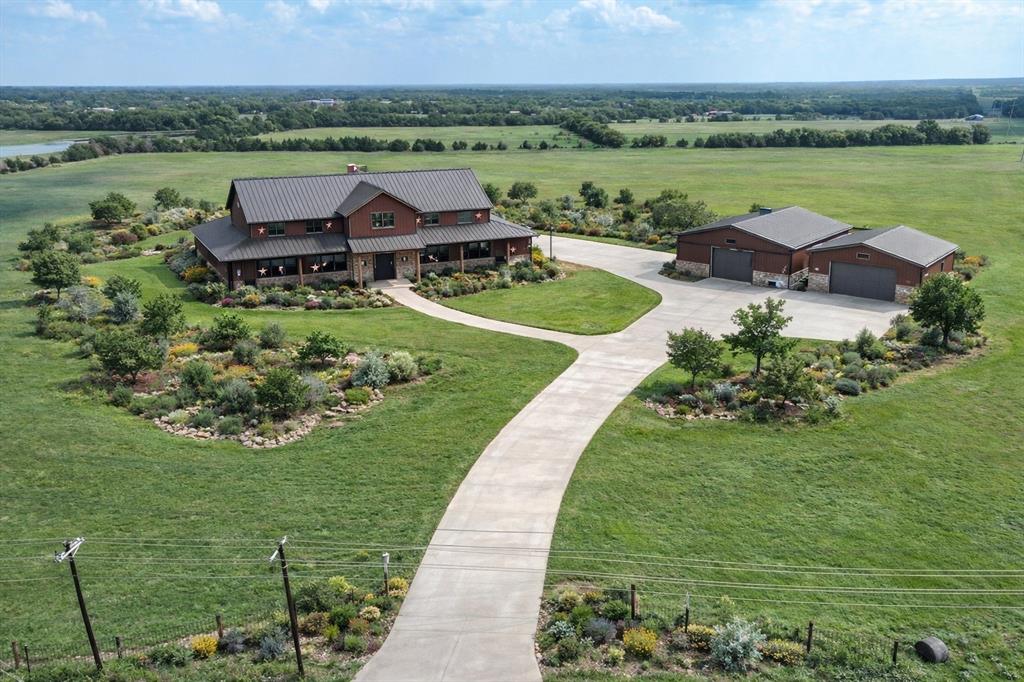 3486 FM 3486, Unit 4 Terrell, TX 75160 - Photo 13 of 15 an aerial view of a house with garden space and outdoor seating