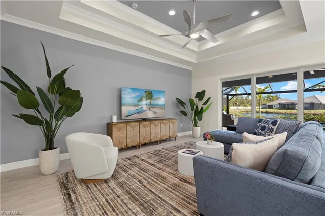 a living room with furniture potted plant and a window