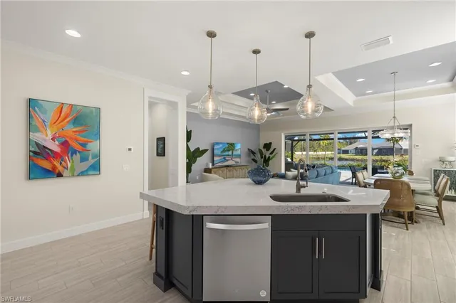 a room with pool table and chairs