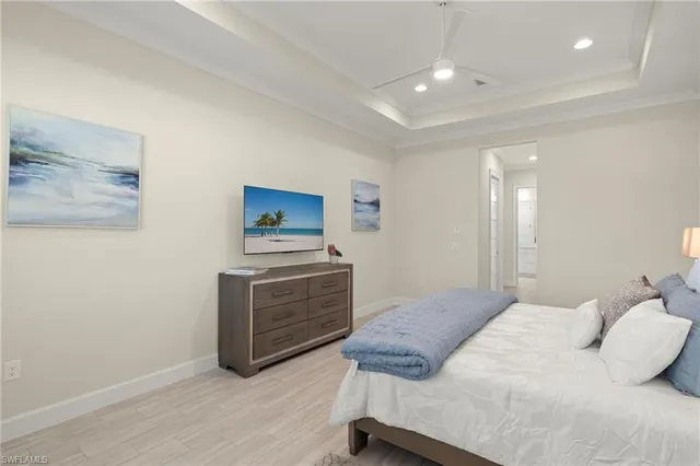 a bedroom with a bed and cabinets