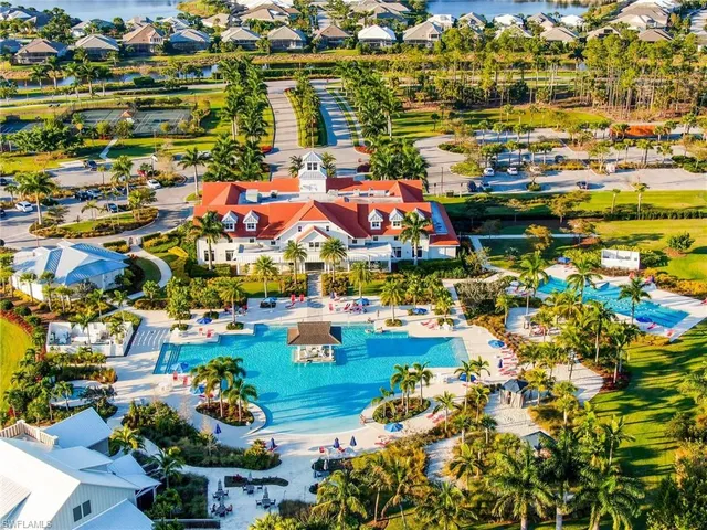 an aerial view of a house with a lake view