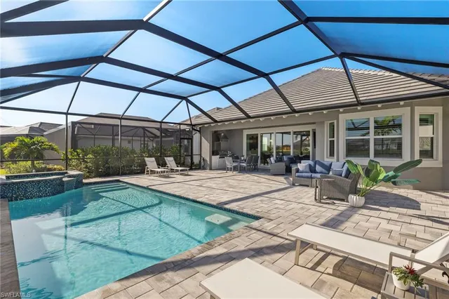 a view of a backyard with sitting area