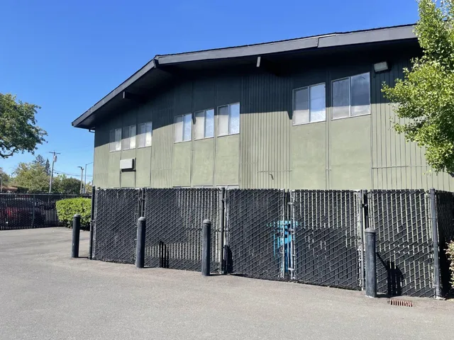 a side view of a house with a garage