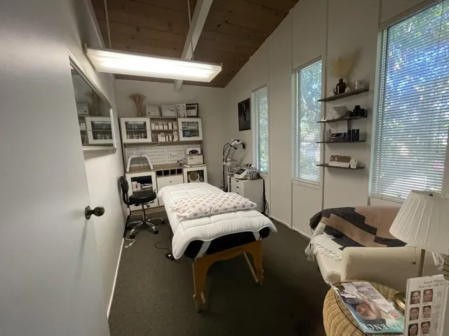 a bedroom with furniture and a book shelf
