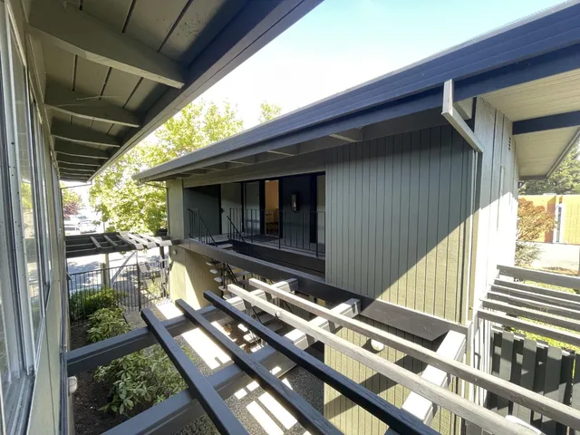 a backyard of a house with seating space