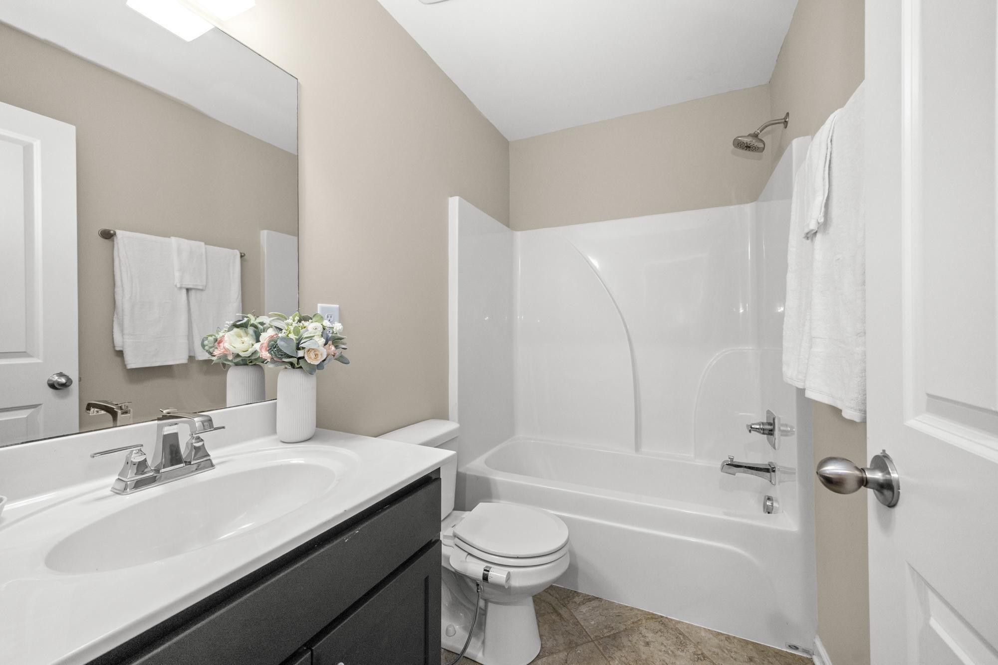 112 Bergen Drive Spring Hill, TN 37174 - Photo 33 of 37 a bathroom with a granite countertop sink toilet and shower