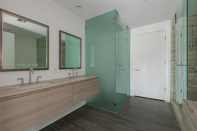 a view of a lake with couches and city view