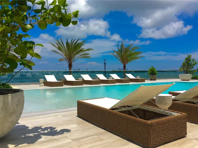 a view of swimming pool with a yard