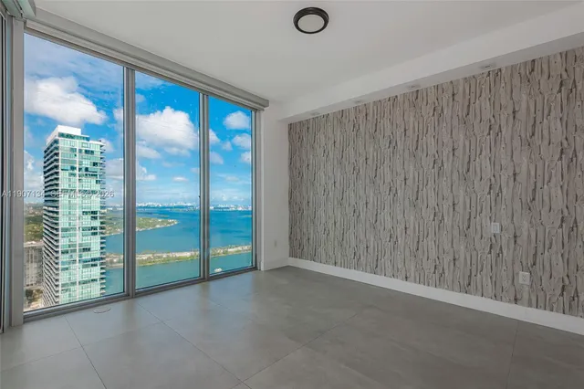 a view of swimming pool with outdoor seating and plants