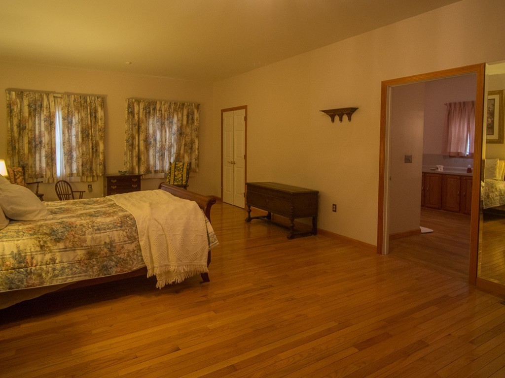 20 Davis Road Westminster, MA 01473 - Photo 20 of 25 a bed room with a bed and a chair