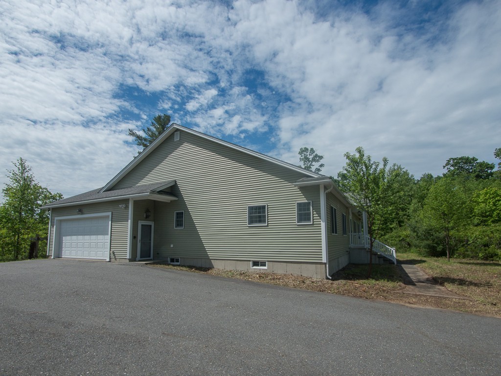 20 Davis Road Westminster, MA 01473 - Photo 3 of 25 a view of a house with a yard and garage